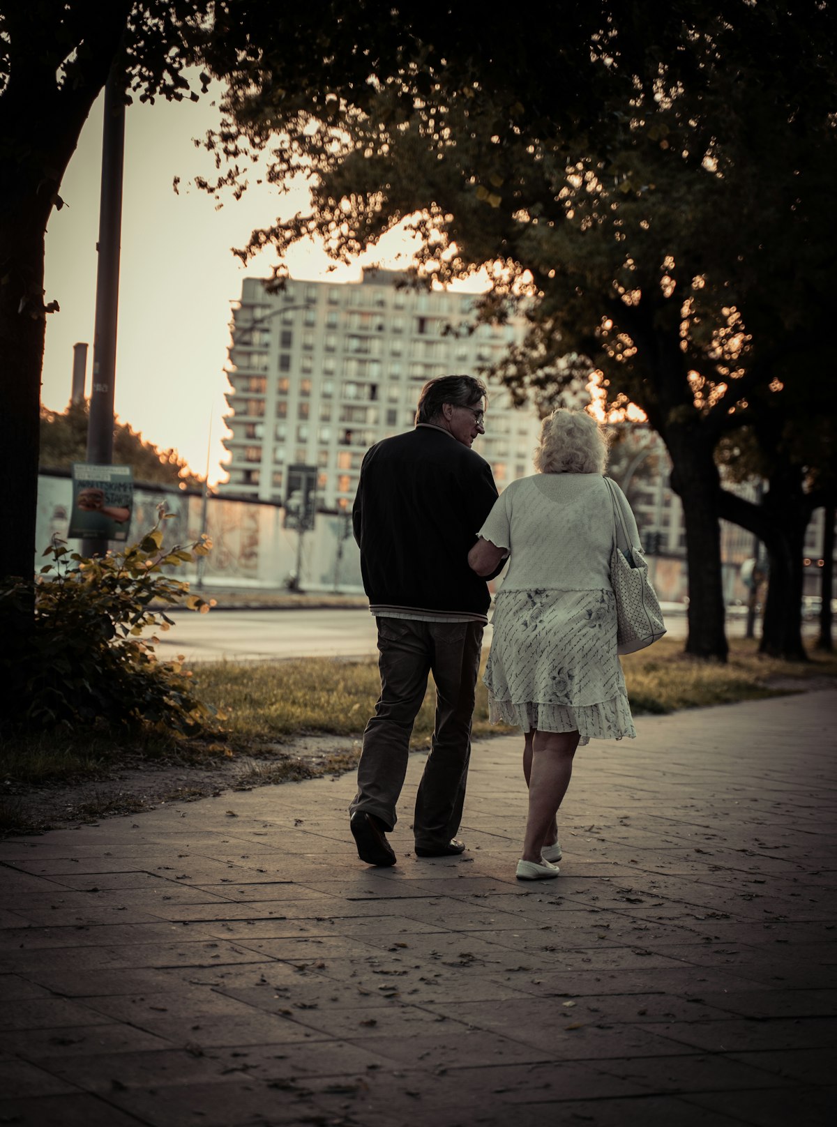 Couple aged 40-65 next to a residential building in France